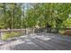 Large outdoor deck with wooden railings, ideal for entertaining and enjoying the view of the backyard at 5421 Brownlee Rd, Stone Mountain, GA 30087