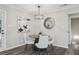 Cozy dining area with modern lighting, neutral decor, and hardwood flooring at 5421 Brownlee Rd, Stone Mountain, GA 30087