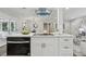 Open-concept kitchen featuring an island with a cooktop, oven, and seating area at 5421 Brownlee Rd, Stone Mountain, GA 30087
