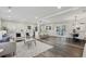 Open-concept living room with hardwood floors, lots of light, and a combined kitchen/dining area at 5421 Brownlee Rd, Stone Mountain, GA 30087