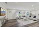 Bright living room featuring hardwood floors, modern decor, and lots of natural light at 5421 Brownlee Rd, Stone Mountain, GA 30087