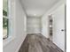 Large storage room with neutral paint, wood-look floors, a window, and shelving at 5421 Brownlee Rd, Stone Mountain, GA 30087
