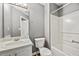 Clean bathroom features a shower-tub combo with neutral finishes at 9511 Rollinghills Dr, Jonesboro, GA 30238