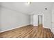 Neutral bedroom with wood-look floors and vaulted ceilings at 9511 Rollinghills Dr, Jonesboro, GA 30238
