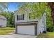 Charming two-story home featuring a two-car garage and traditional curb appeal at 9511 Rollinghills Dr, Jonesboro, GA 30238