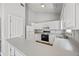 Bright kitchen with ample counter space and stainless steel appliances at 9511 Rollinghills Dr, Jonesboro, GA 30238