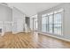 Open living room area with high ceilings, hardwood floors, and natural light at 9511 Rollinghills Dr, Jonesboro, GA 30238