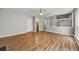 Spacious living room with wood laminate flooring and view of stairs at 9511 Rollinghills Dr, Jonesboro, GA 30238