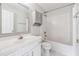 Bathroom featuring a shower-tub combo, a large mirror, and a white vanity sink at 1363 Penhurst Dr, Lawrenceville, GA 30043