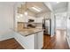 Well-equipped kitchen featuring granite countertops, stainless steel appliances, and modern lighting at 1363 Penhurst Dr, Lawrenceville, GA 30043