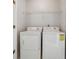 Efficient laundry room features standard-sized washer and dryer at 1363 Penhurst Dr, Lawrenceville, GA 30043