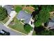 Aerial view of a house showcasing its mature landscaping, driveway, and surrounding neighborhood at 260 Ruby Forest Pkwy, Suwanee, GA 30024
