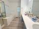 Large bathroom features a soaking tub, separate shower, and double sink vanity at 260 Ruby Forest Pkwy, Suwanee, GA 30024