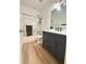 Modern bathroom with a shower, gray vanity with a white countertop at 260 Ruby Forest Pkwy, Suwanee, GA 30024