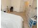 Bedroom features a large bed, wood-look floors, and neutral colored walls at 260 Ruby Forest Pkwy, Suwanee, GA 30024