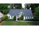 Charming single-story home with stone accents, manicured lawn, and mature trees adding curb appeal at 260 Ruby Forest Pkwy, Suwanee, GA 30024