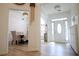 Bright foyer with hardwood floors, white walls, and a view into the dining room at 260 Ruby Forest Pkwy, Suwanee, GA 30024