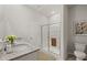 Clean bathroom with double sinks, a walk-in shower, toilet, and modern decor at 3178 Birdsong Ave, Covington, GA 30016