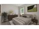 Cozy bedroom featuring a comfortable bed, wooden dresser, and large window with a view at 3178 Birdsong Ave, Covington, GA 30016