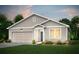 Charming single-story home with a well-manicured lawn, attached garage, and inviting front entrance at 3178 Birdsong Ave, Covington, GA 30016