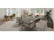 Open concept living room featuring neutral furniture, large windows, and a dining area at 3178 Birdsong Ave, Covington, GA 30016