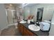 This well-lit bathroom offers dual sinks, a bathtub and shower combination, and a neutral color scheme at 51 Freedom Ne Dr, Cartersville, GA 30121