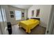 Bedroom with light coming from window with blind; art on the wall, dark wood furniture, and neutral carpet at 51 Freedom Ne Dr, Cartersville, GA 30121