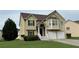 Traditional two-story home features a two-car garage, brick-accented entrance, manicured lawn and decorative trim work at 51 Freedom Ne Dr, Cartersville, GA 30121
