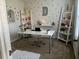 This home office is decorated with shelves, plants, and unique wall decor to create a productive workspace at 51 Freedom Ne Dr, Cartersville, GA 30121