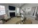 This living room has a decorative fireplace, floating shelves, and neutral furniture for a cozy atmosphere at 51 Freedom Ne Dr, Cartersville, GA 30121