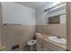 Bathroom with toilet, sink with granite countertop and backsplash with decorative tile detail at 1443 Snapfinger Rd, Decatur, GA 30032