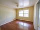 This bedroom has natural light and wood flooring at 1443 Snapfinger Rd, Decatur, GA 30032