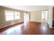 View of the living room with a large window, and wooden floors at 1443 Snapfinger Rd, Decatur, GA 30032