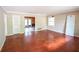 Living room with hardwood floors, a large window and interior doorway at 1443 Snapfinger Rd, Decatur, GA 30032