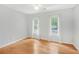 Cozy bedroom with hardwood floors, ceiling fan and windows providing natural light at 1915 Milfield Cir, Snellville, GA 30078