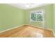 Comfortable bedroom with hardwood floors, a ceiling fan and great window views at 1915 Milfield Cir, Snellville, GA 30078