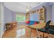 Bright bedroom with built-in bookshelves, a futon, and a ceiling fan at 1915 Milfield Cir, Snellville, GA 30078