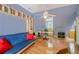 Unique bedroom with built-in bookshelves, a hardwood floor and a ceiling fan at 1915 Milfield Cir, Snellville, GA 30078