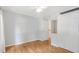 Bright bedroom with hardwood floors, a ceiling fan and a mirrored closet at 1915 Milfield Cir, Snellville, GA 30078