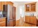 Kitchen with stainless steel refrigerator and wood floors at 1915 Milfield Cir, Snellville, GA 30078