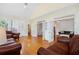 Open concept living area with hardwood floors and many windows at 1915 Milfield Cir, Snellville, GA 30078