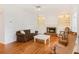 Bright living room with hardwood floors, fireplace, and built-in shelving at 1915 Milfield Cir, Snellville, GA 30078