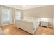 Bedroom with hardwood floors, tray ceiling, and lots of light at 1915 Milfield Cir, Snellville, GA 30078