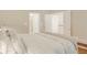 Relaxing main bedroom featuring a neutral color palette and access to an ensuite bathroom at 1915 Milfield Cir, Snellville, GA 30078