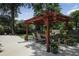 An eye-level shot of the backyard pergola with a table and chairs at 1915 Milfield Cir, Snellville, GA 30078