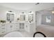 Well-lit bathroom boasts dual vanity, ample cabinet space, and access to the bedroom at 2350 Twelvestones Dr, Roswell, GA 30076