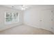 Bedroom with neutral walls and carpet, ceiling fan, and one window at 2350 Twelvestones Dr, Roswell, GA 30076