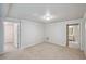 Carpeted bonus room with neutral walls, multiple doorways, and recessed lighting at 2350 Twelvestones Dr, Roswell, GA 30076