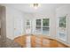 Breakfast nook with hardwood floors and bright windows with views of outside at 2350 Twelvestones Dr, Roswell, GA 30076