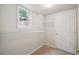 Walk-in closet featuring a small window, carpet, and metal shelving at 2350 Twelvestones Dr, Roswell, GA 30076